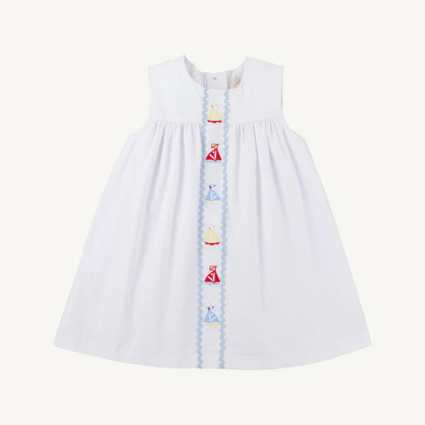 white sleeveless dress with colorful sailboats down the middle 