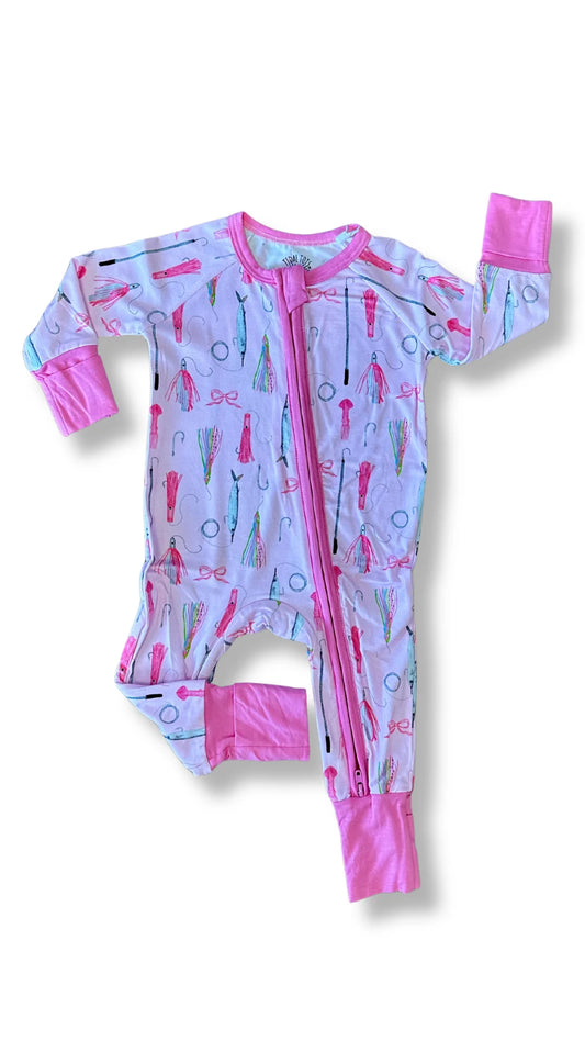A baby long-sleeve footed sleeper with a pink zipper, featuring a light lavender-blue background patterned with pink and green fishing lures and solid pink cuffs and collar.