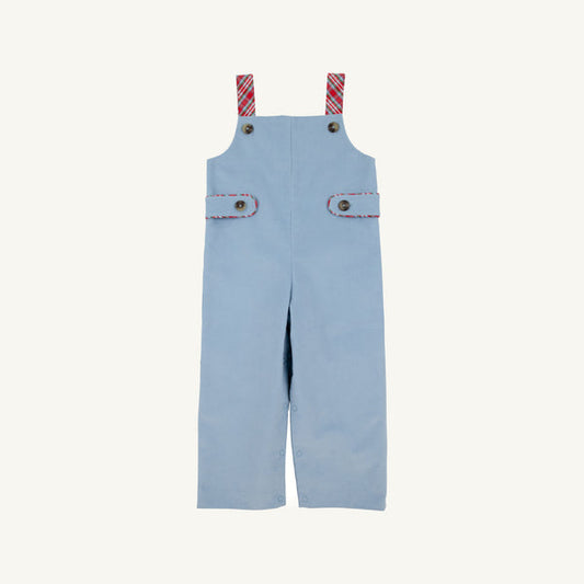 A pair of light blue corduroy baby overalls with red and white striped shoulder straps and decorative button details, shown flat on a light cream background.