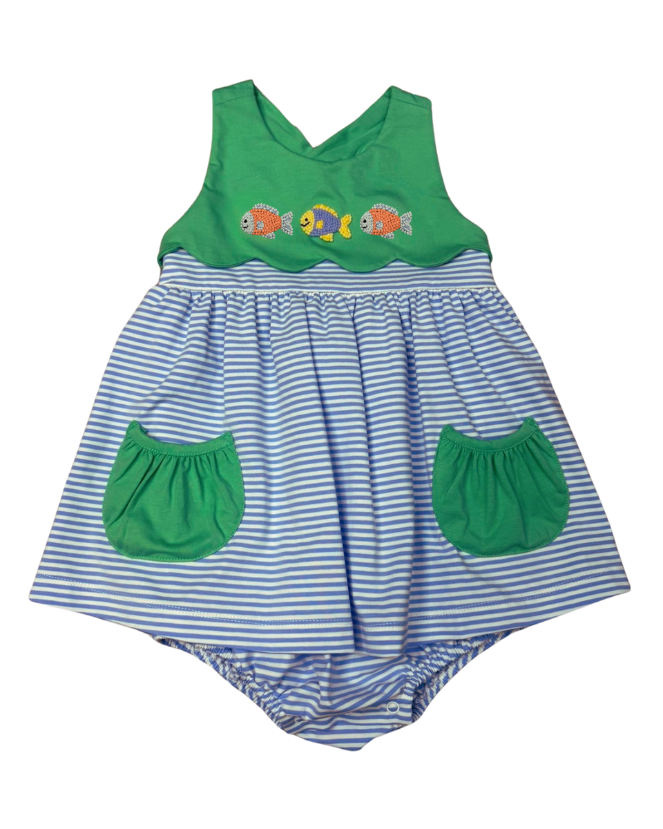 Blue striped dress with attached bubble, with green pockets and bodice; bodice has three embroidered goldfish.