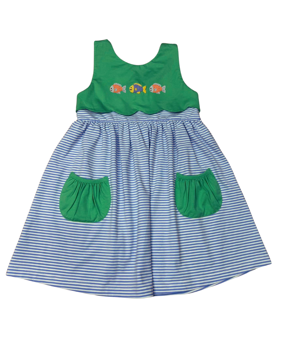 Blue striped dress with green pockets and bodice, three embroidered fish on scalloped bodice.