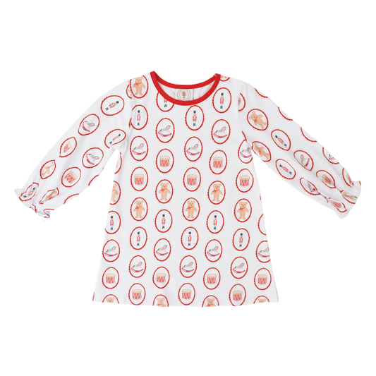 A white long-sleeve t-shirt with a red crew neck collar, featuring an all-over repeating pattern of christmas toys