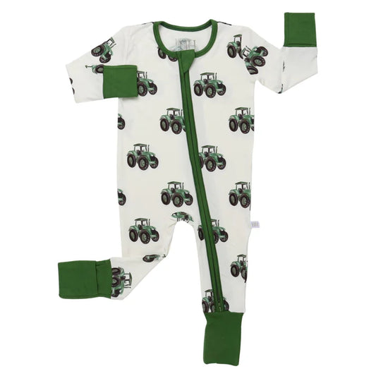 One piece zipper pajama with green trim and a green tractor design.