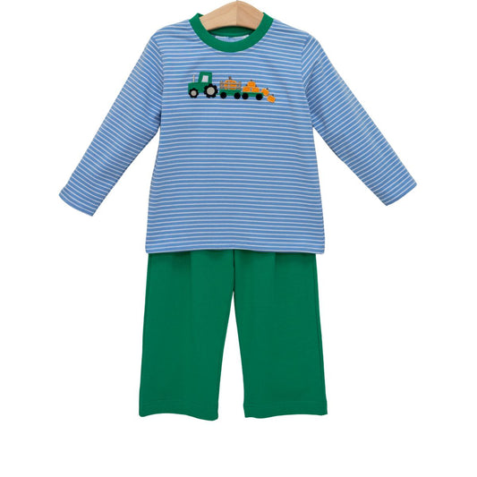 A two-piece children's long-sleeve pajama set on a wooden hanger, featuring a light blue and white striped top with a green tractor graphic, paired with solid green pants.
