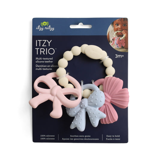 Itzy Ritzy silicone teether bow set packaging with three different textures on a blue background.