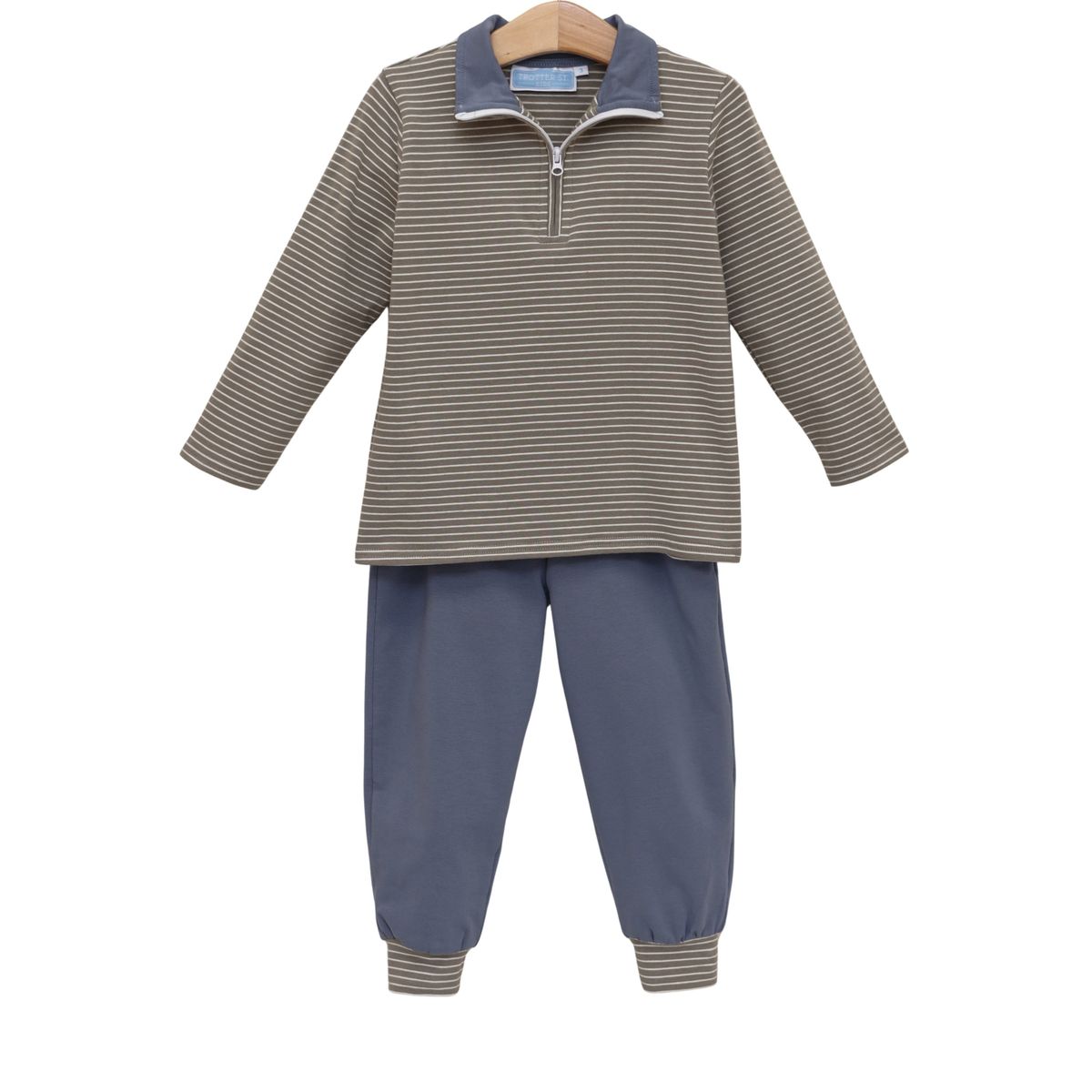 Children's outfit with striped shirt and blue pants on a white background