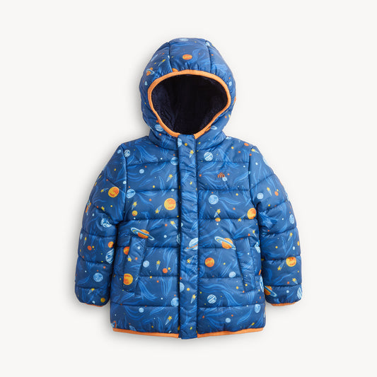 A blue hooded puffer jacket with an all-over space print featuring planets, stars, and nebulae, accented with orange trim on the hood lining and hem.