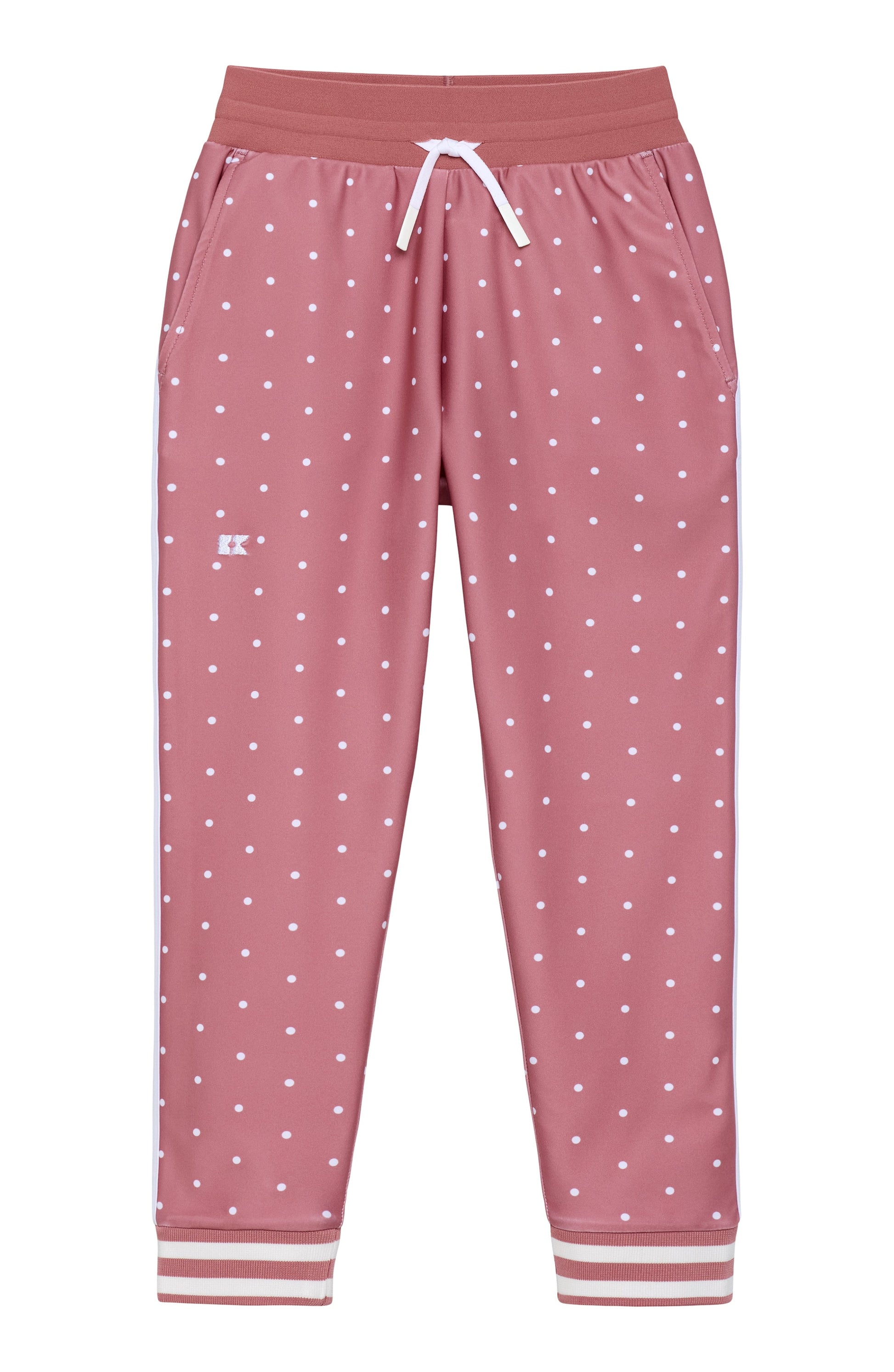 Pink jogger pants with a white polka dot pattern, featuring an elastic waistband with a white drawstring and striped cuffs.