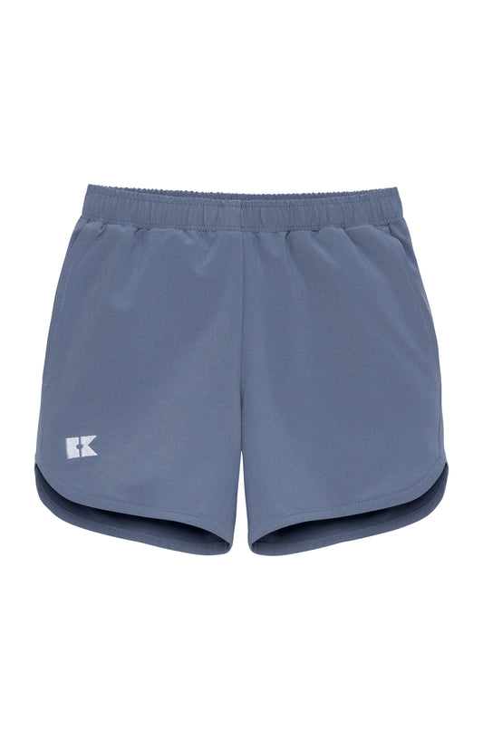 A pair of slate blue athletic shorts with an elastic waistband and a small white logo 