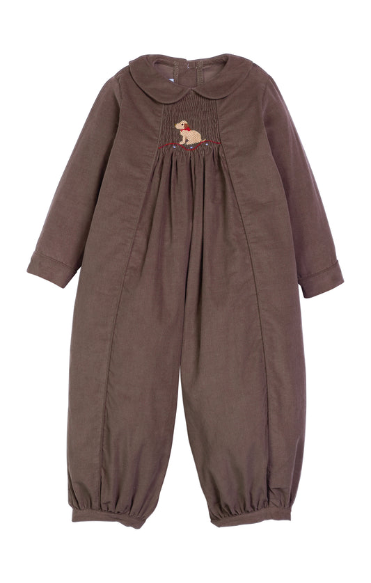 A dark brown long-sleeve baby jumpsuit with a Peter Pan collar, gathered smocked chest detailing, and a small embroidered dog motif, shown against a plain white background.