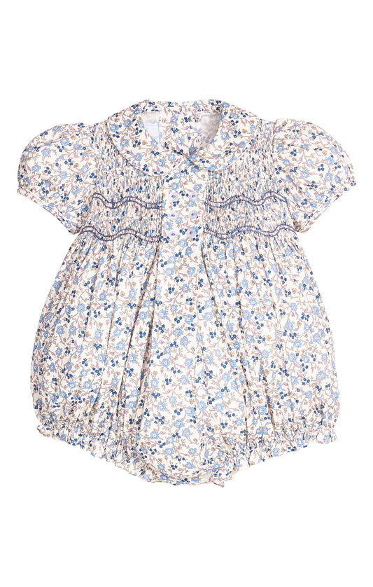 Floral smocked baby romper on a white background