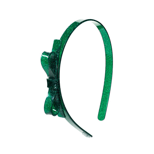 Green headband with decorative elements on a white background