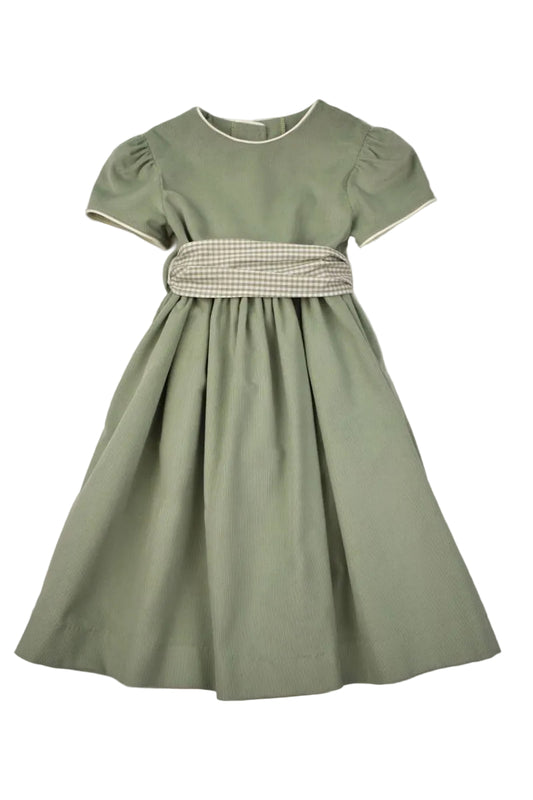 A sage green short-sleeve dress with a gingham patterned waist sash, laid flat against a light gray background.