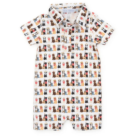 A baby short-sleeve romper with a white base and an all-over repeating print of various dog breeds and red hearts, laid flat on a white background.