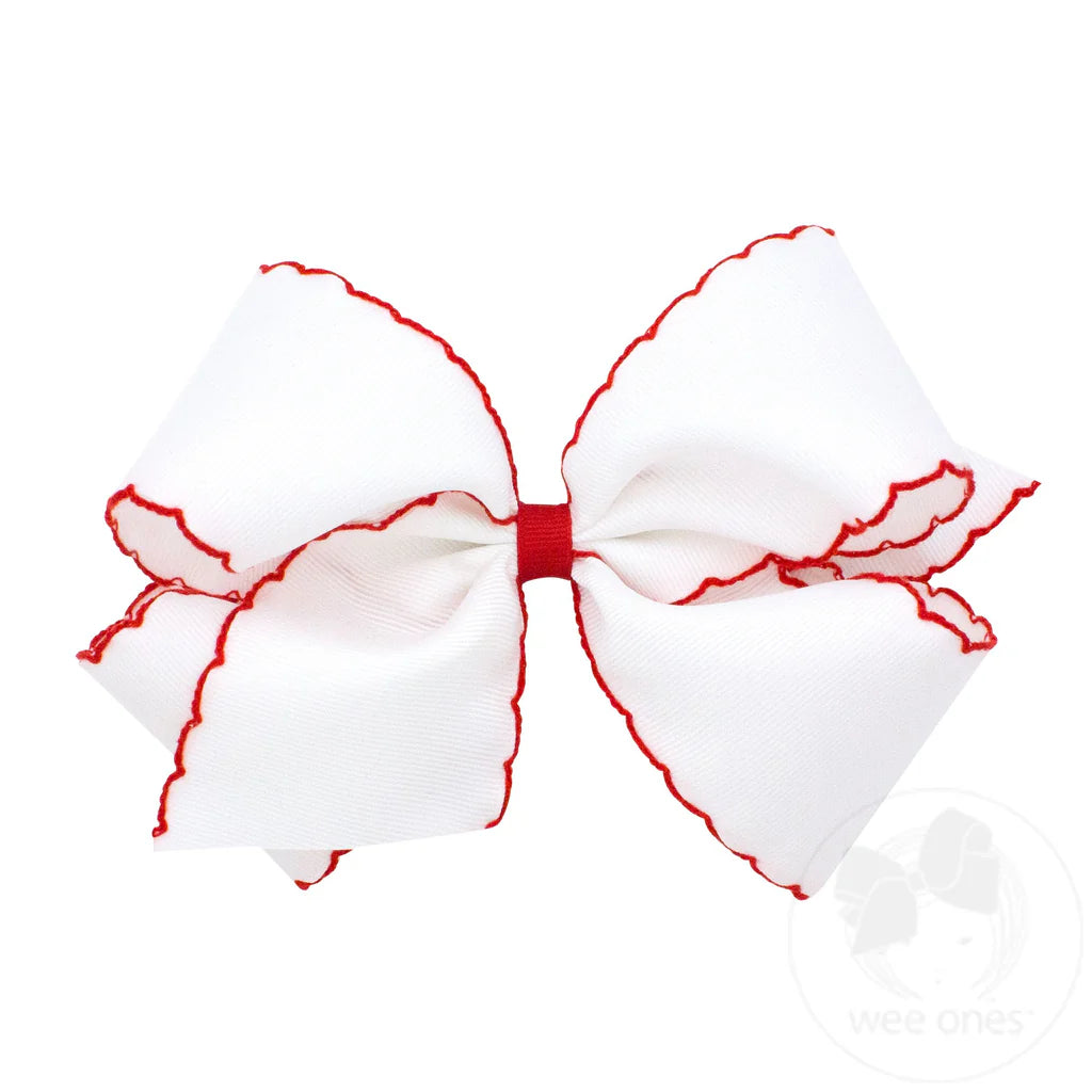White king bow with red moonstitch trim

