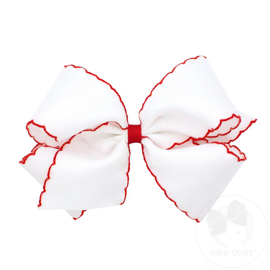 White king bow with red moonstitch trim
