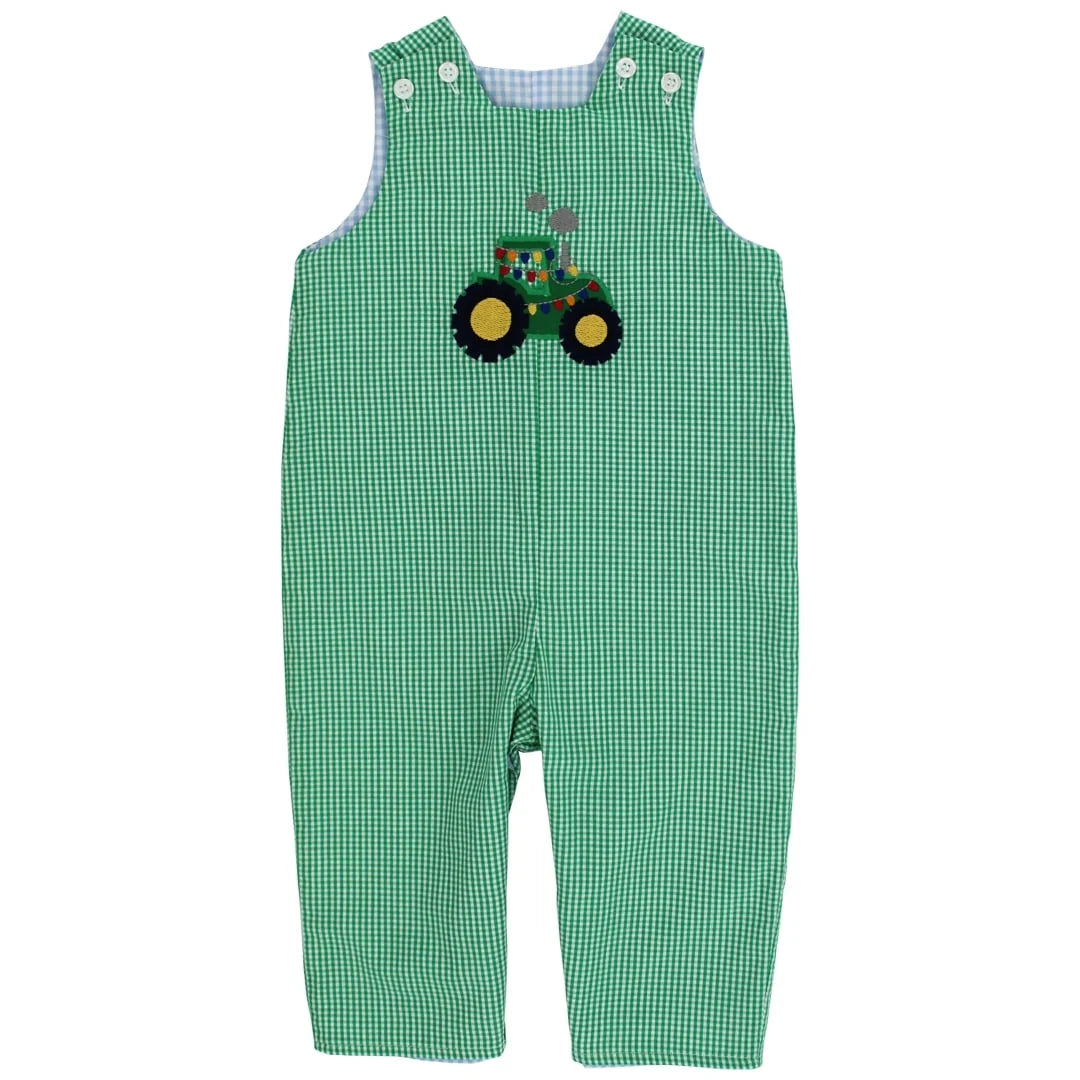 Green and white gingham baby overalls featuring a colorful embroidered tractor applique on the chest, displayed flat against a white background.