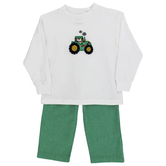 A toddler's two-piece pant set featuring a white long-sleeve shirt with a green tractor applique on the chest, paired with green and white gingham pants.